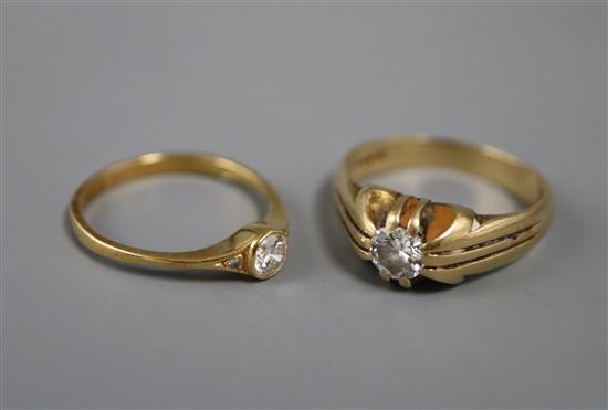 Two 18ct gold and solitaire diamond rings, sizes N & Q.